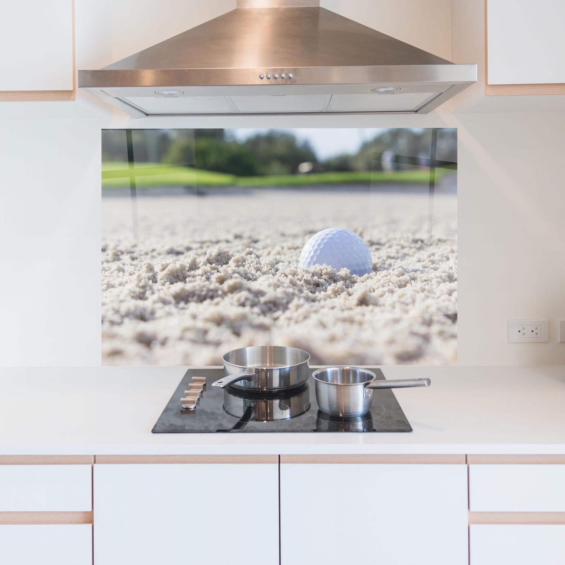 Küchenrückwand Glas Golf Ball In Sand mockup 5
